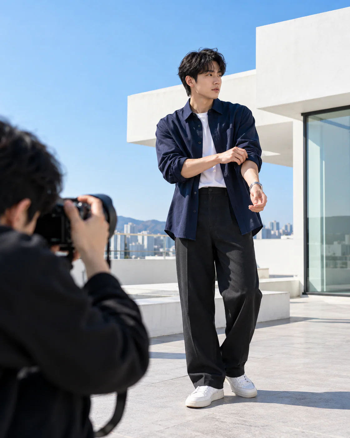 Creator posing for a profile photo on a rooftop