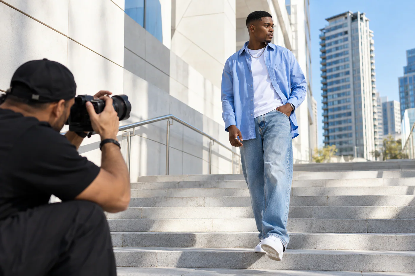 Creator photographed on city steps for a profile shoot